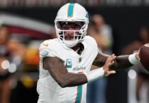 Dolphins’ Tua Tagovailoa battles illness to throw 4 TDs vs Falcons